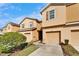 Exterior view of townhomes with attached garages and manicured landscaping at 8842 Turnstone Haven Pl, Tampa, FL 33619