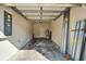 Spacious garage featuring concrete floors, white walls, and ample room for parking at 8842 Turnstone Haven Pl, Tampa, FL 33619