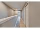 Upstairs hallway with wood floors, closet, and neutral paint at 8842 Turnstone Haven Pl, Tampa, FL 33619