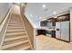 Spacious kitchen features stainless steel appliances, dark cabinetry, and an open floor plan at 8842 Turnstone Haven Pl, Tampa, FL 33619