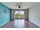 Hardwood floor living room with sliding glass doors overlooking backyard at 8842 Turnstone Haven Pl, Tampa, FL 33619