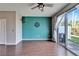 Living room with hardwood floors and an accent wall at 8842 Turnstone Haven Pl, Tampa, FL 33619