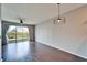 Hardwood floor living room with sliding glass doors overlooking backyard at 8842 Turnstone Haven Pl, Tampa, FL 33619