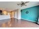 Bright open floor plan featuring hardwood floors and access to the stairs and kitchen at 8842 Turnstone Haven Pl, Tampa, FL 33619