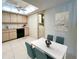 Eat-in kitchen with dining table and adjacent laundry area enhances functionality at 9221 Repondo Pl, New Port Richey, FL 34655