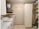 Laundry room with large water heater, washer and dryer, and built in closet for storage at 9221 Repondo Pl, New Port Richey, FL 34655