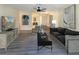 Bright living room features modern furnishings, stylish decor, and wood-look flooring at 9221 Repondo Pl, New Port Richey, FL 34655