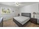 Bedroom features a ceiling fan, large windows, and a comfortable layout at 9718 Tiffany Oaks Ln # 12, Tampa, FL 33612