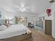 Bright bedroom with large window, complemented by a serene color palette and ample furniture at 9718 Tiffany Oaks Ln # 12, Tampa, FL 33612