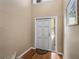 Bright foyer with hardwood floors, a staircase to the left, and a decorative rug at 9718 Tiffany Oaks Ln # 12, Tampa, FL 33612
