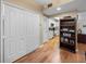 Hallway area that leads into the kitchen with wood-look flooring at 9718 Tiffany Oaks Ln # 12, Tampa, FL 33612