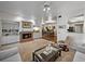 Open-concept living room with fireplace, built-in shelving, and views into the dining area at 9718 Tiffany Oaks Ln # 12, Tampa, FL 33612