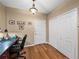 Home office or flex space with wood flooring, natural light, and closet at 9718 Tiffany Oaks Ln # 12, Tampa, FL 33612