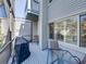 Outdoor patio featuring a grill covered with a black cover, table and chairs, with views of the yard at 9718 Tiffany Oaks Ln # 12, Tampa, FL 33612
