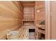 Inviting sauna room featuring wood plank walls and benches at 9902 Menander Wood Ct, Odessa, FL 33556