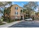 Inviting condo exterior featuring well-maintained landscaping and convenient parking at 10105 Courtney Oaks Cir # 301, Tampa, FL 33619