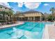 Resort-style pool with lounge chairs and umbrellas at Courtney Palms, providing relaxation and recreation for residents at 10105 Courtney Oaks Cir # 301, Tampa, FL 33619