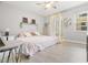 Bright bedroom featuring a ceiling fan, decorative shelves, and soft, inviting decor at 107 S Obrien St # 217, Tampa, FL 33609