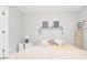 Cozy bedroom with a plush bed, decorative shelf, and soft natural light at 107 S Obrien St # 217, Tampa, FL 33609
