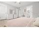 Airy bedroom featuring ample natural light, light laminate flooring and a modern dresser at 107 S Obrien St # 217, Tampa, FL 33609