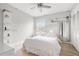 Bright bedroom featuring a ceiling fan, wood floors, and built-in shelving at 107 S Obrien St # 217, Tampa, FL 33609