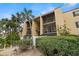 Condo exterior view of the building showcasing mature landscaping, and screened balconies at 107 S Obrien St # 217, Tampa, FL 33609