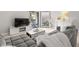 Cozy living room featuring a plush gray sofa, soft decor, and a door to the outside at 107 S Obrien St # 217, Tampa, FL 33609