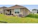 Expansive backyard with a covered patio, ideal for outdoor living and enjoying the serene surroundings at 10864 Penny Gale Loop, San Antonio, FL 33576