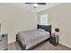 Comfortable bedroom with a bed, nightstand, and carpeted floors at 10864 Penny Gale Loop, San Antonio, FL 33576