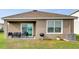 Cozy covered patio with comfortable seating, perfect for outdoor relaxation and entertaining at 10864 Penny Gale Loop, San Antonio, FL 33576