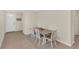 Cozy dining area featuring a modern table and chairs set on a stylish rug at 10864 Penny Gale Loop, San Antonio, FL 33576