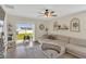 Bright living room with large windows offering water views, comfortable seating, and stylish decor at 10864 Penny Gale Loop, San Antonio, FL 33576
