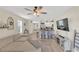 Open concept living area with a modern kitchen, bar seating, and comfortable seating arrangement at 10864 Penny Gale Loop, San Antonio, FL 33576