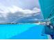 Scenic view of a vibrant water park against a stormy sky with a rainbow at 10864 Penny Gale Loop, San Antonio, FL 33576