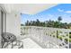 Private balcony with views of palm trees and street offers a peaceful outdoor space for relaxing and enjoying the scenery at 1100 N Shore Ne Dr # 304, St Petersburg, FL 33701