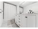 Modern bathroom featuring a double sink vanity with marble countertop and sleek black hardware at 1100 N Shore Ne Dr # 304, St Petersburg, FL 33701