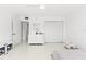 Cozy bedroom featuring a ceiling fan, shuttered windows, and ample closet space at 1100 N Shore Ne Dr # 304, St Petersburg, FL 33701