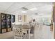 Cozy common area features tables and chairs, perfect for socializing or relaxing with a book from the built-in bookcase at 1100 N Shore Ne Dr # 304, St Petersburg, FL 33701