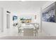 Bright and airy dining room with modern design and a glimpse of the balcony view at 1100 N Shore Ne Dr # 304, St Petersburg, FL 33701
