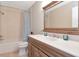 Bathroom with vanity and shower tub, complemented by neutral earth tone colors throughout at 11121 Clayridge Dr, Tampa, FL 33635