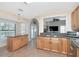 Open kitchen with granite countertops, stainless steel appliances, and a view into the living room at 11121 Clayridge Dr, Tampa, FL 33635