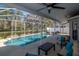 Screened patio with plenty of room for outdoor seating around the sparkling pool at 11121 Clayridge Dr, Tampa, FL 33635