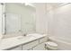 Bathroom featuring a vanity, subway tile shower-tub combo, and modern fixtures at 1226 Mumford Ct, Zephyrhills, FL 33540