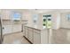 Open-concept kitchen with an island, stainless steel appliances, and plenty of natural light at 1226 Mumford Ct, Zephyrhills, FL 33540