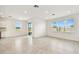 Open-concept living space with tile flooring, recessed lighting and multiple windows for natural light at 1226 Mumford Ct, Zephyrhills, FL 33540