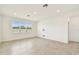 Bright living room with tile flooring, recessed lighting and a large window offering lots of natural light at 1226 Mumford Ct, Zephyrhills, FL 33540