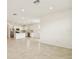 Open-concept living space featuring a modern kitchen with stainless steel appliances and ample counter space at 1226 Mumford Ct, Zephyrhills, FL 33540