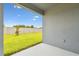 Covered patio with view of fenced in lawn and greenery at 1226 Mumford Ct, Zephyrhills, FL 33540