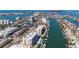 Scenic aerial shot showcasing waterfront condos surrounded by beautiful waterways and a vibrant community at 125 Island Way # 404, Clearwater Beach, FL 33767