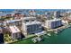 Stunning aerial view showcasing the condo's waterfront location, boat docks, and proximity to the city at 125 Island Way # 404, Clearwater Beach, FL 33767